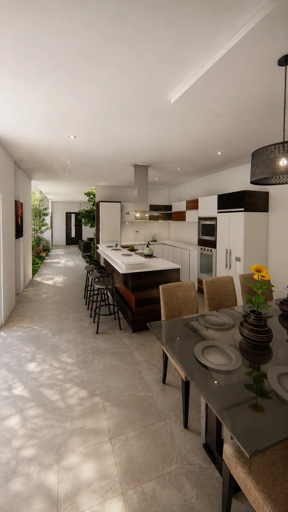 Cocina abierta con isla y barra de desayuno, frente al pasillo que lleva al jardín interior