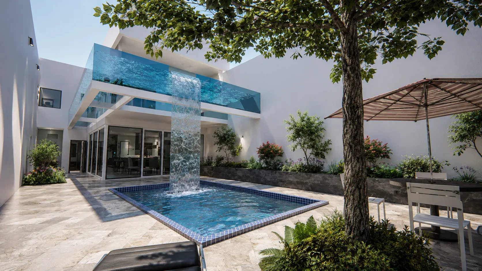 Piscina elevada de muro acristalado con cascada sobre el patio de una vivienda unifamiliar